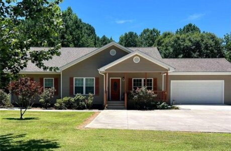 Front elevation of a ranch home on acreage in Buchanan GA